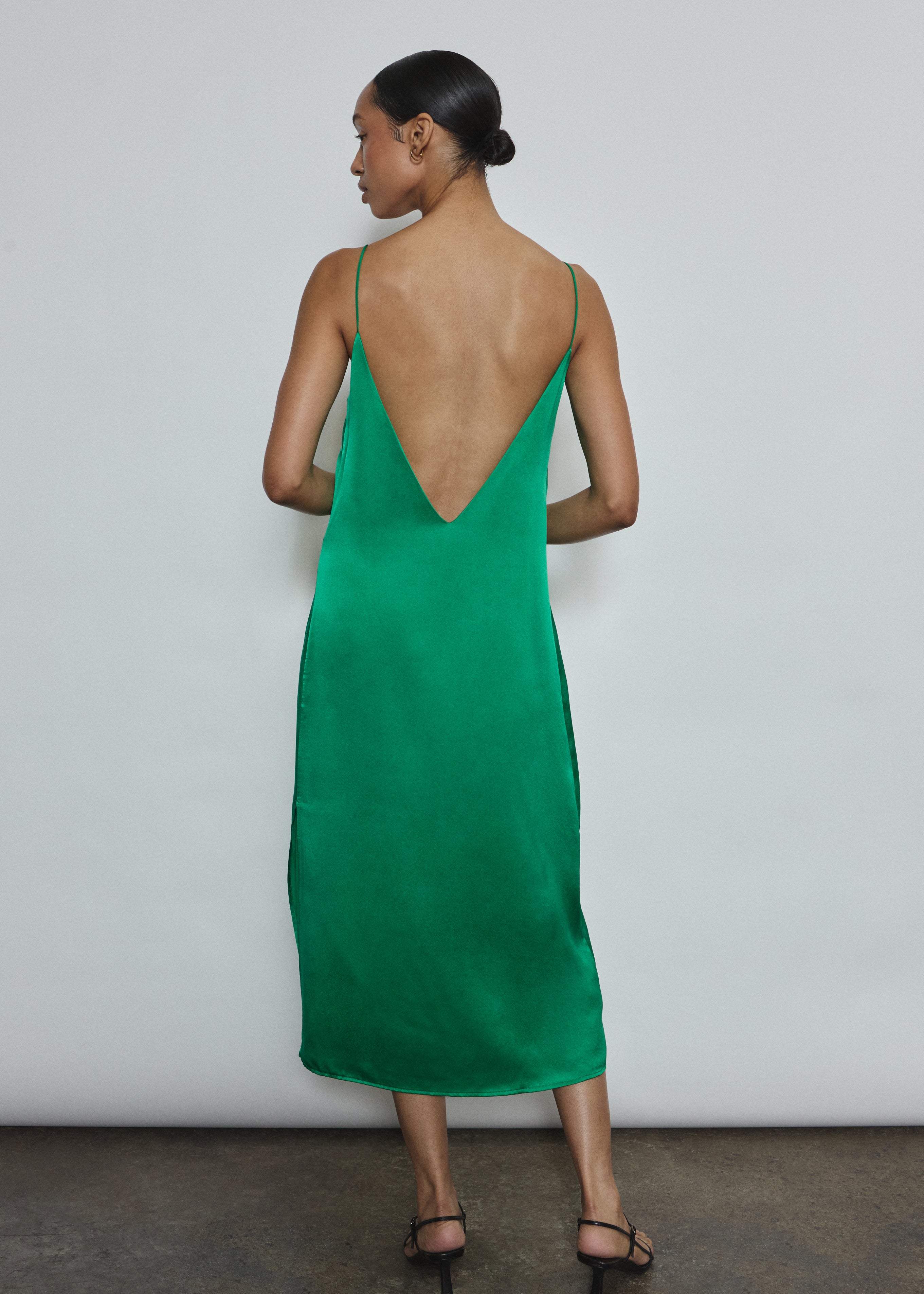 Back view of the kelly green silk charmeuse Kamperett Sade Slip Dress showing the dramatic V back.