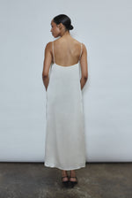 Back view of the ivory silk charmeuse Kamperett Agnes Slip Dress with straight-cut back and fixed corded straps.