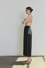 Back view of the black silk crepe Kamperett Alix Silk Crepe Pant showing the pull-on elastic waistband.