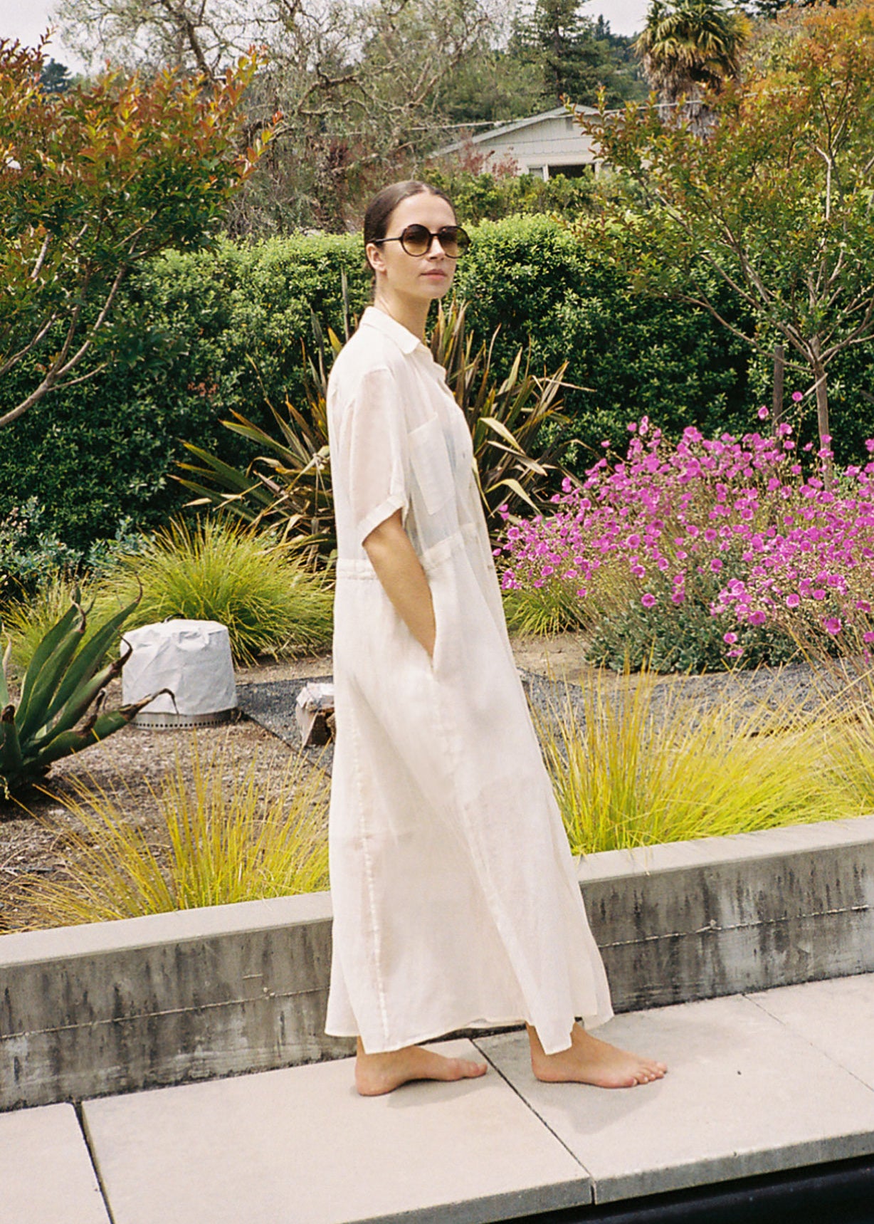 Angled view of the white semi-sheer Japanese cotton voile Kamperett Antoine Shirt Dress.