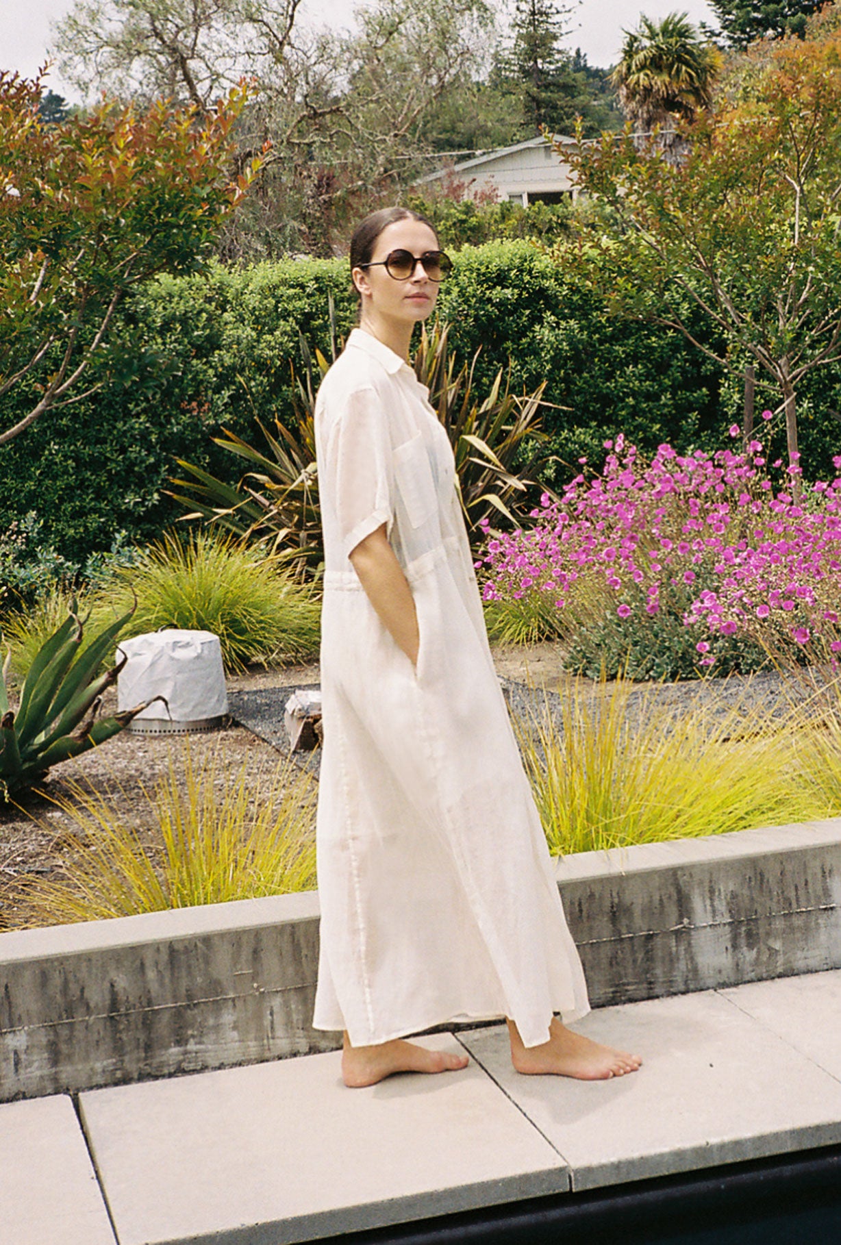 Angled view of the white semi-sheer Japanese cotton voile Kamperett Antoine Shirt Dress.