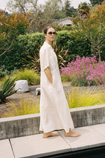 Angled view of the white semi-sheer Japanese cotton voile Kamperett Antoine Shirt Dress.