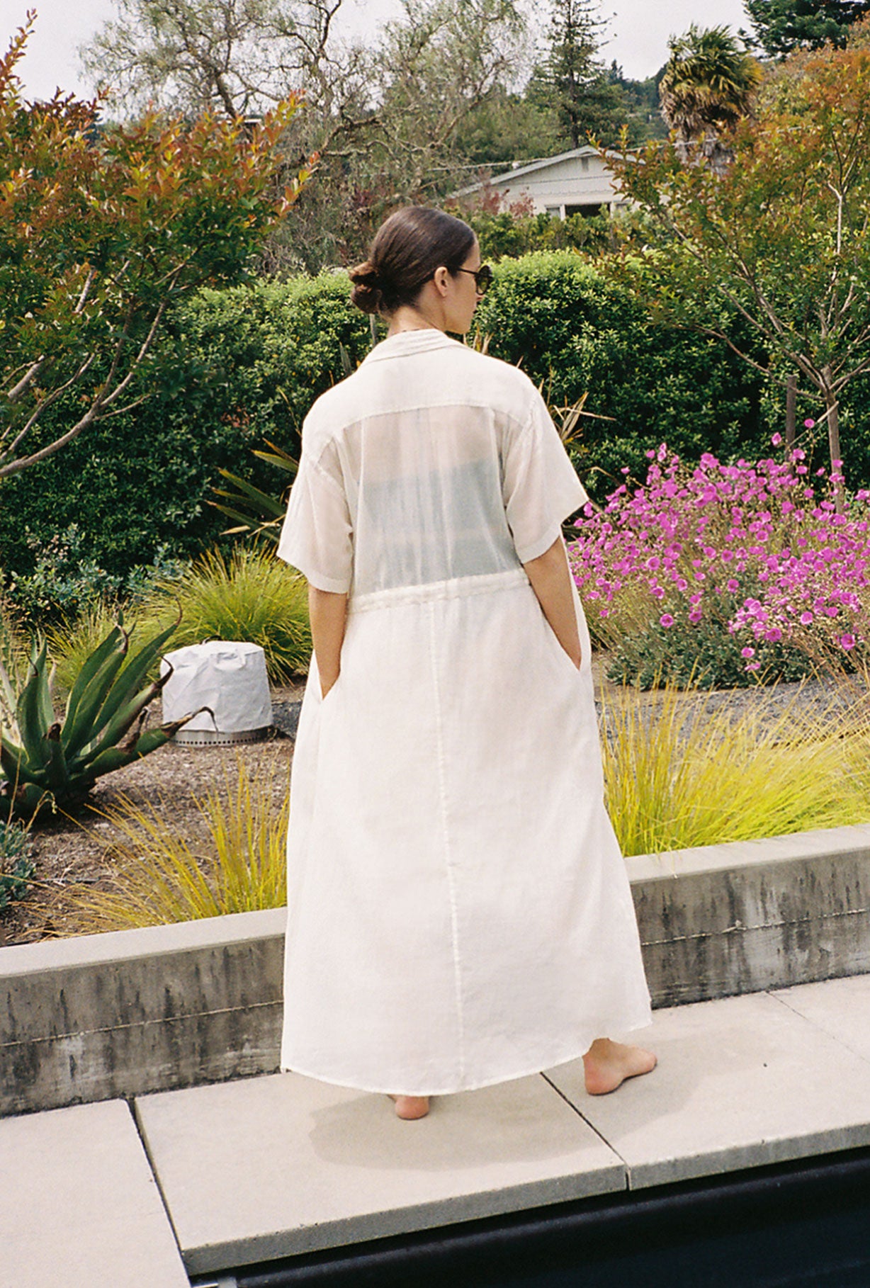 Editorial image of the white semi-sheer Japanese cotton voile Kamperett Antoine Shirt Dress.