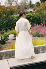 Editorial image of the white semi-sheer Japanese cotton voile Kamperett Antoine Shirt Dress.