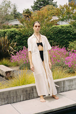 Side view of the white semi-sheer Japanese cotton voile Kamperett Antoine Shirt Dress.