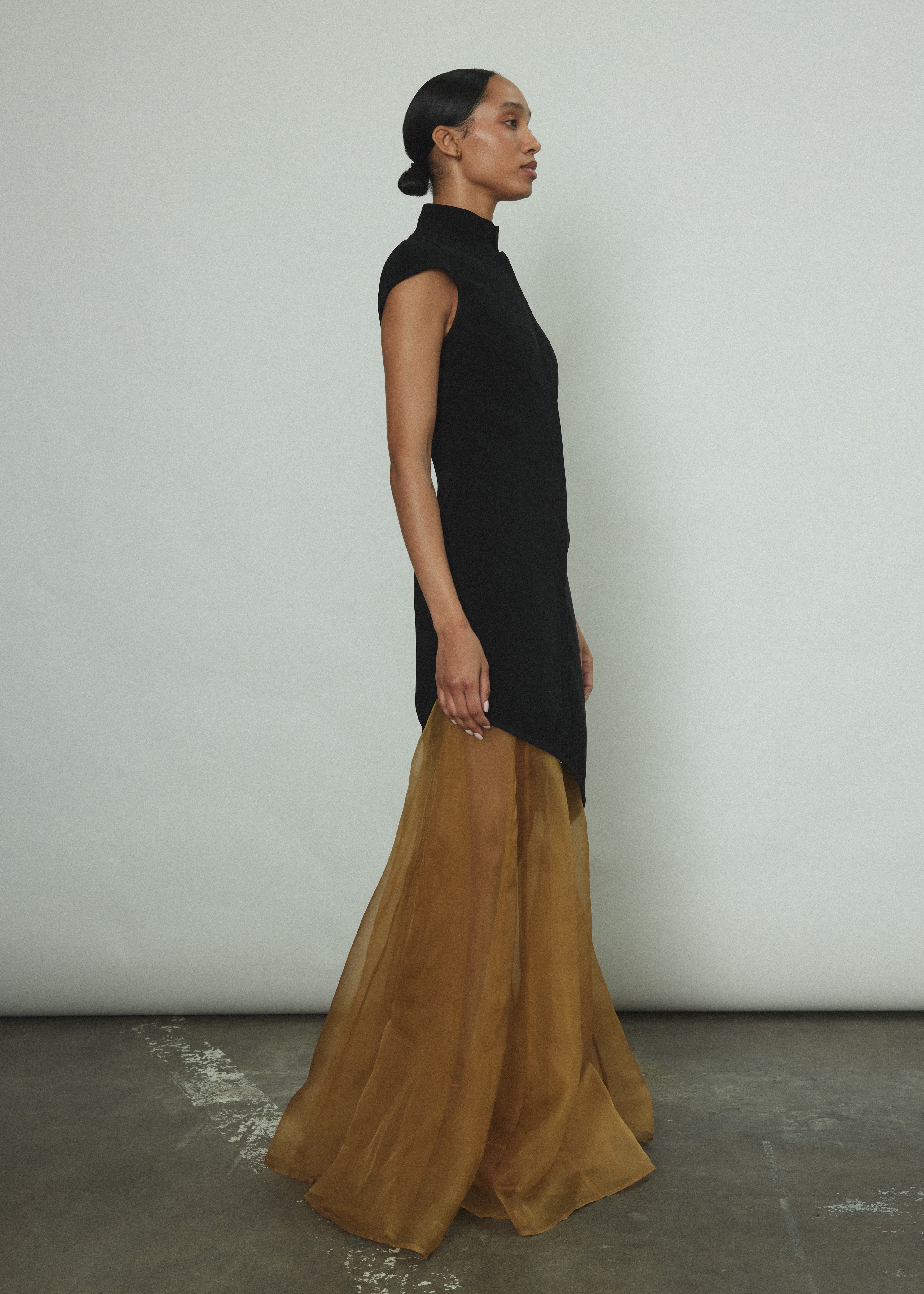 Back view of the black wool flannel Kamperett Astrid Vest with tailored waist.