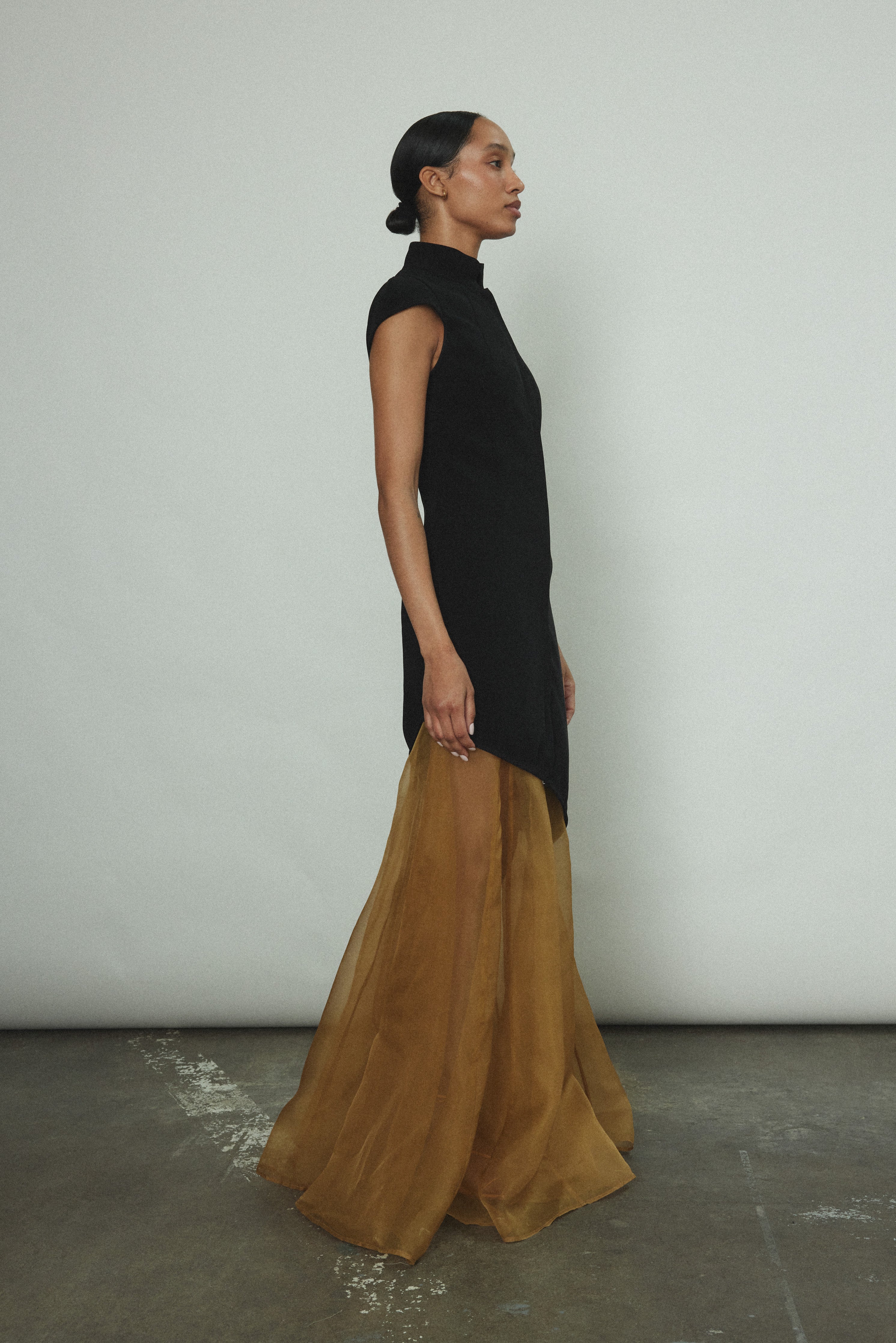 Back view of the black wool flannel Kamperett Astrid Vest with tailored waist.