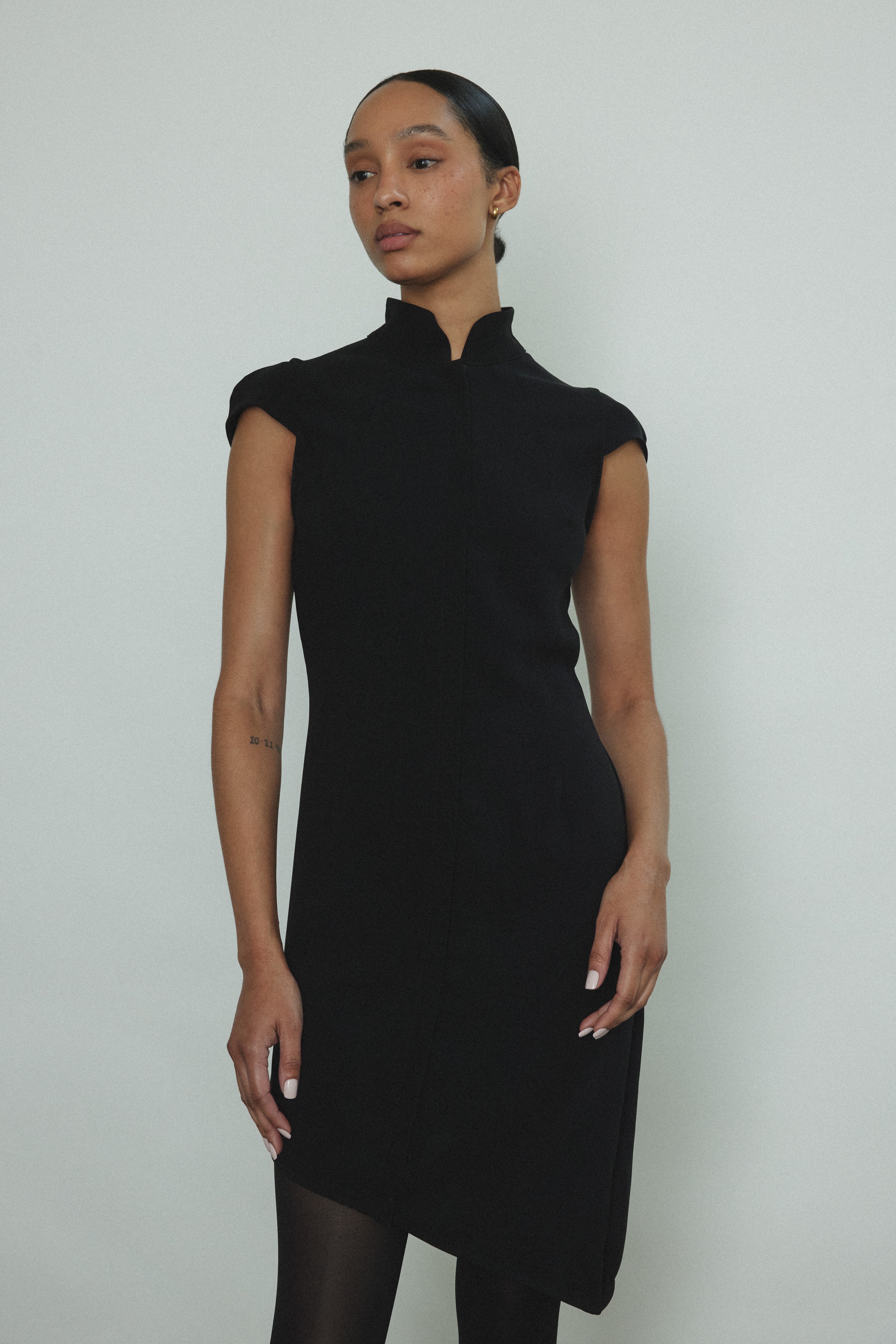 Alternate editorial image of the black wool flannel Kamperett Astrid Vest.