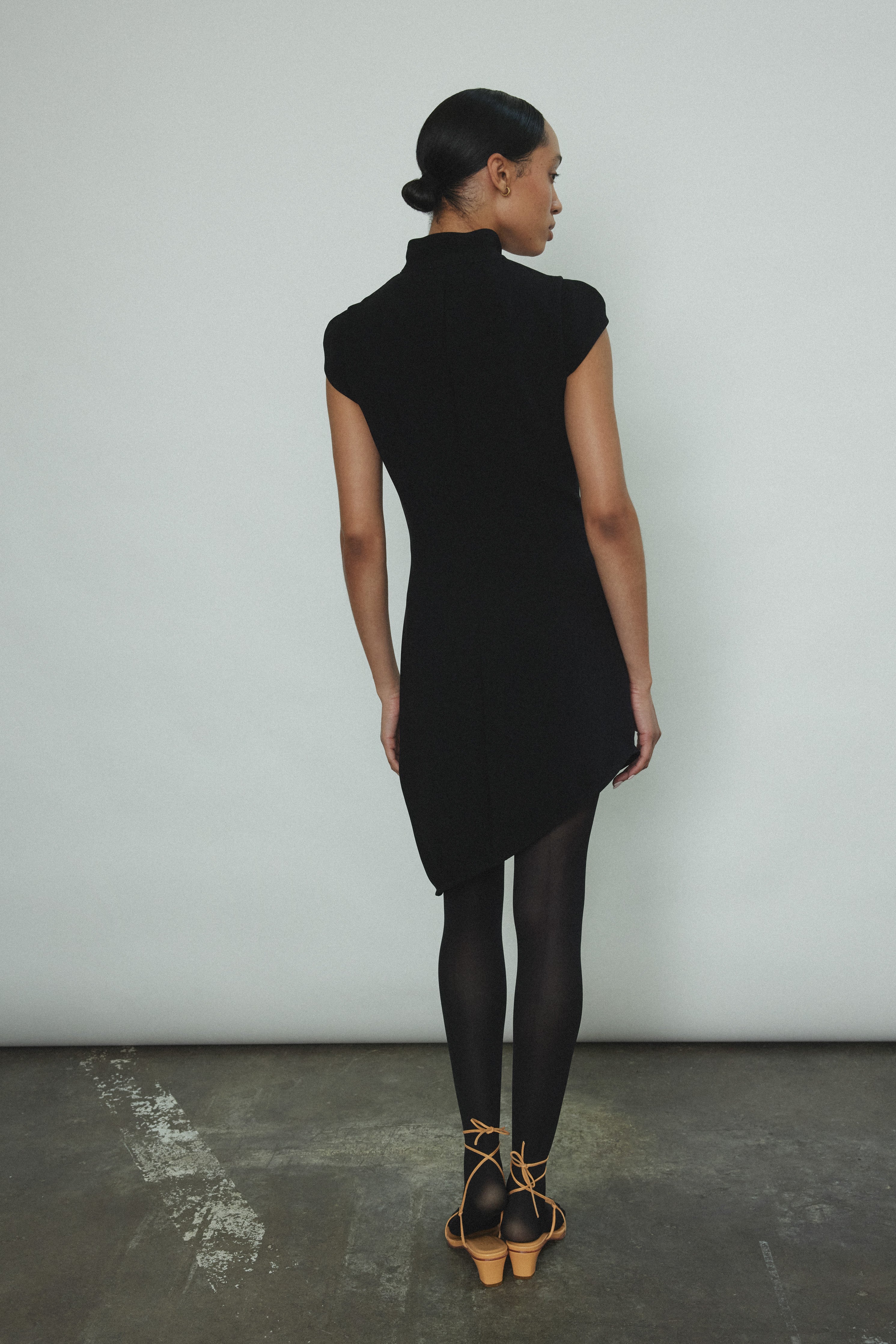 Second alternate editorial image of the black wool flannel Kamperett Astrid Vest.