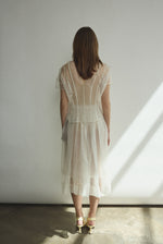 Model wearing the Alabaster silk organza Brise Skirt, showcasing its voluminous silhouette, sheer fabric, and elegant midi-length drape.