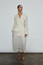 Model wearing the Alabaster silk organza Brise Skirt, showcasing its voluminous silhouette, sheer fabric, and elegant midi-length drape.