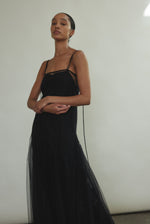 Cropped detail of the black sheer tulle Kamperett Camille Dress bodice with adjustable silk corded straps.