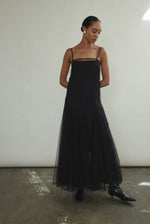 Full-length front view of the black sheer tulle Kamperett Camille Dress with adjustable silk corded straps.