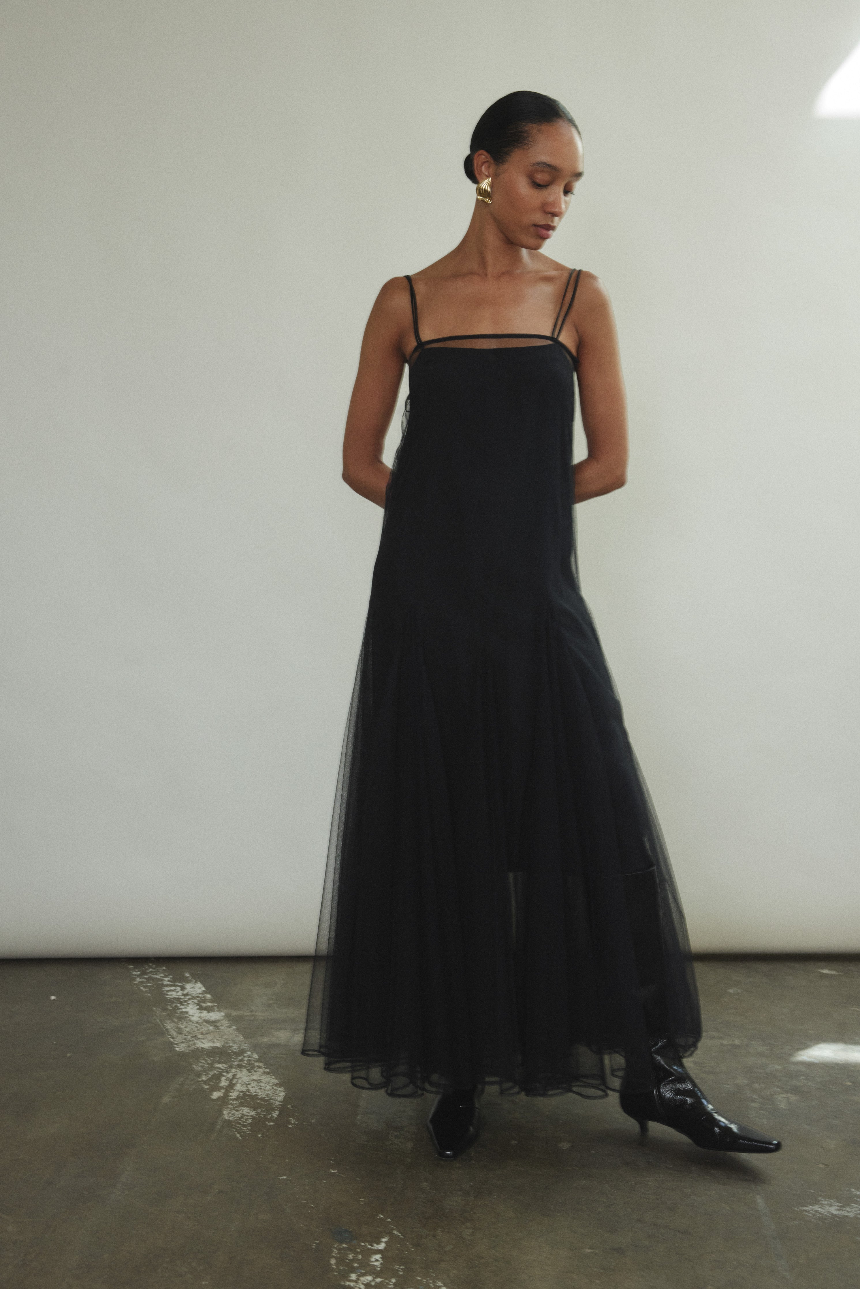 Full-length front view of the black sheer tulle Kamperett Camille Dress with adjustable silk corded straps.