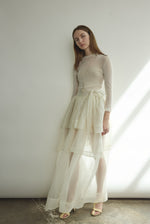 Back view of the alabaster sheer silk organza Kamperett Canna Skirt with self-fabric ties wrapped at the waist.