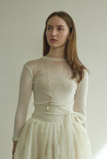 Editorial image of the alabaster silk organza Kamperett Canna Skirt as a modern bridal separates piece.