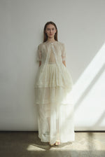 Front view of the alabaster Kamperett Canna Skirt layered over the Brise Skirt for a modern bridal separates look.