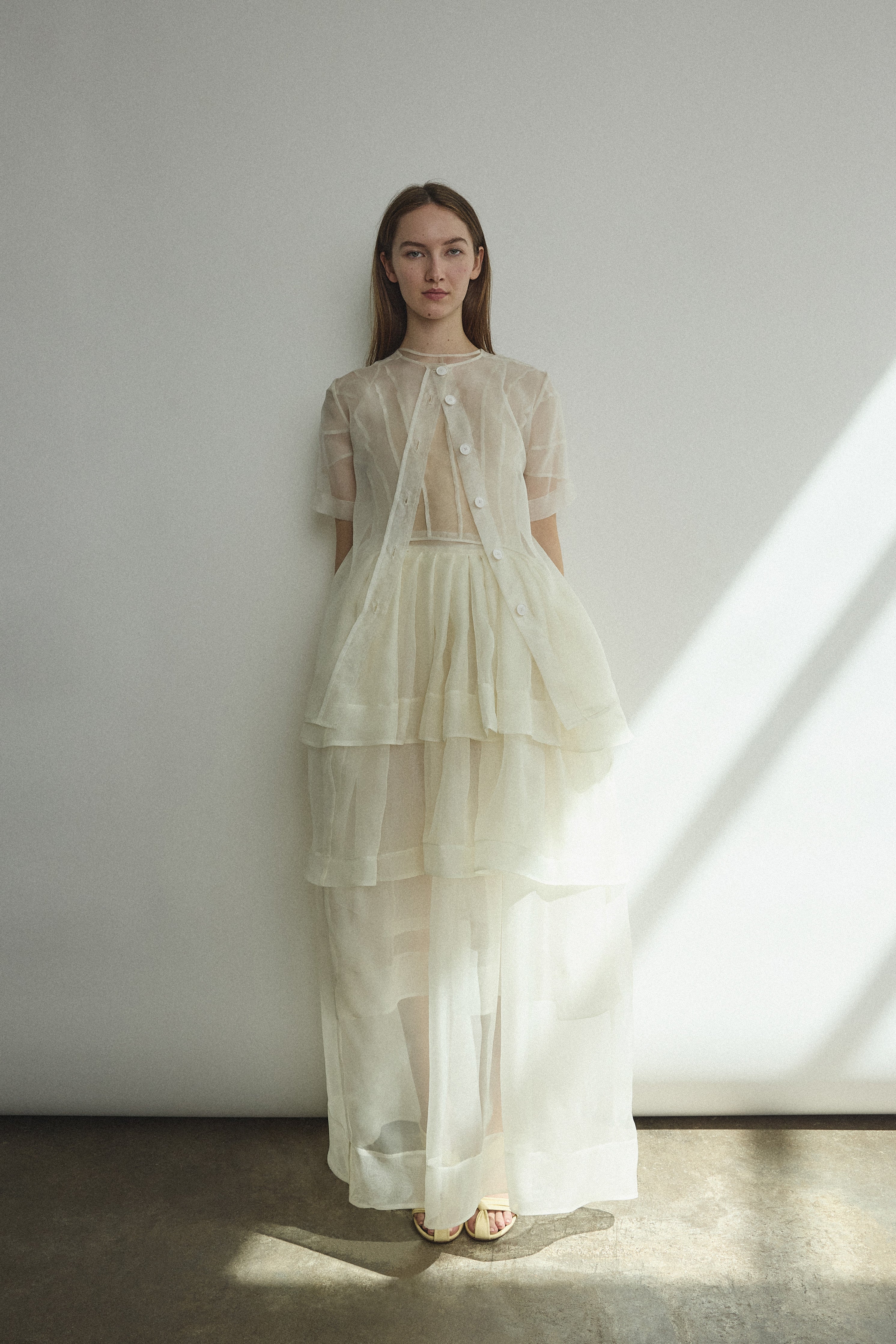 Front view of the alabaster Kamperett Canna Skirt layered over the Brise Skirt for a modern bridal separates look.