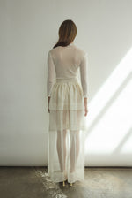 Detail of the self-fabric waistband and long ties on the alabaster silk organza Kamperett Canna Skirt.