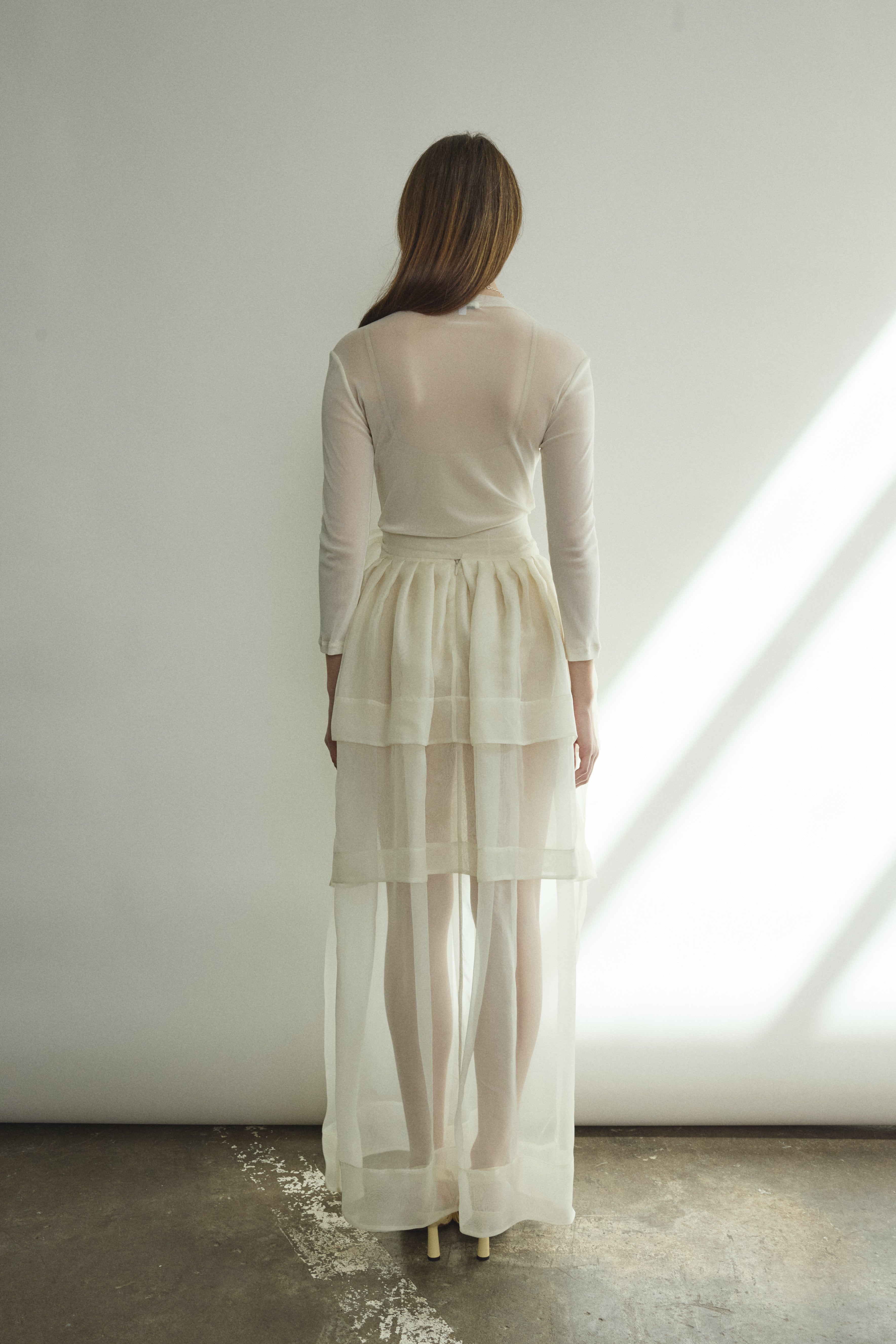 Detail of the self-fabric waistband and long ties on the alabaster silk organza Kamperett Canna Skirt.