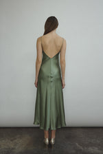 Back view of the jade sueded silk charmeuse Kamperett Caroline Midi Slip Dress with V-back neckline.