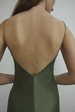 Detail of the corded straps and V-neckline on the jade sueded silk charmeuse Kamperett Caroline Midi Slip Dress.