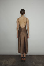 Back view of the mushroom sueded silk charmeuse Kamperett Caroline Midi Slip Dress with V-back neckline.