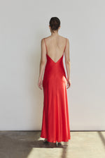Back view of the crimson silk charmeuse Kamperett Caroline Slip Dress with V back and corded straps.