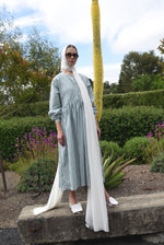 Angled view of the green stripe Japanese cotton Kamperett Cassatt Dress.