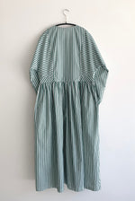 Close-up of the button cuff and dolman sleeve on the green stripe Kamperett Cassatt Dress.