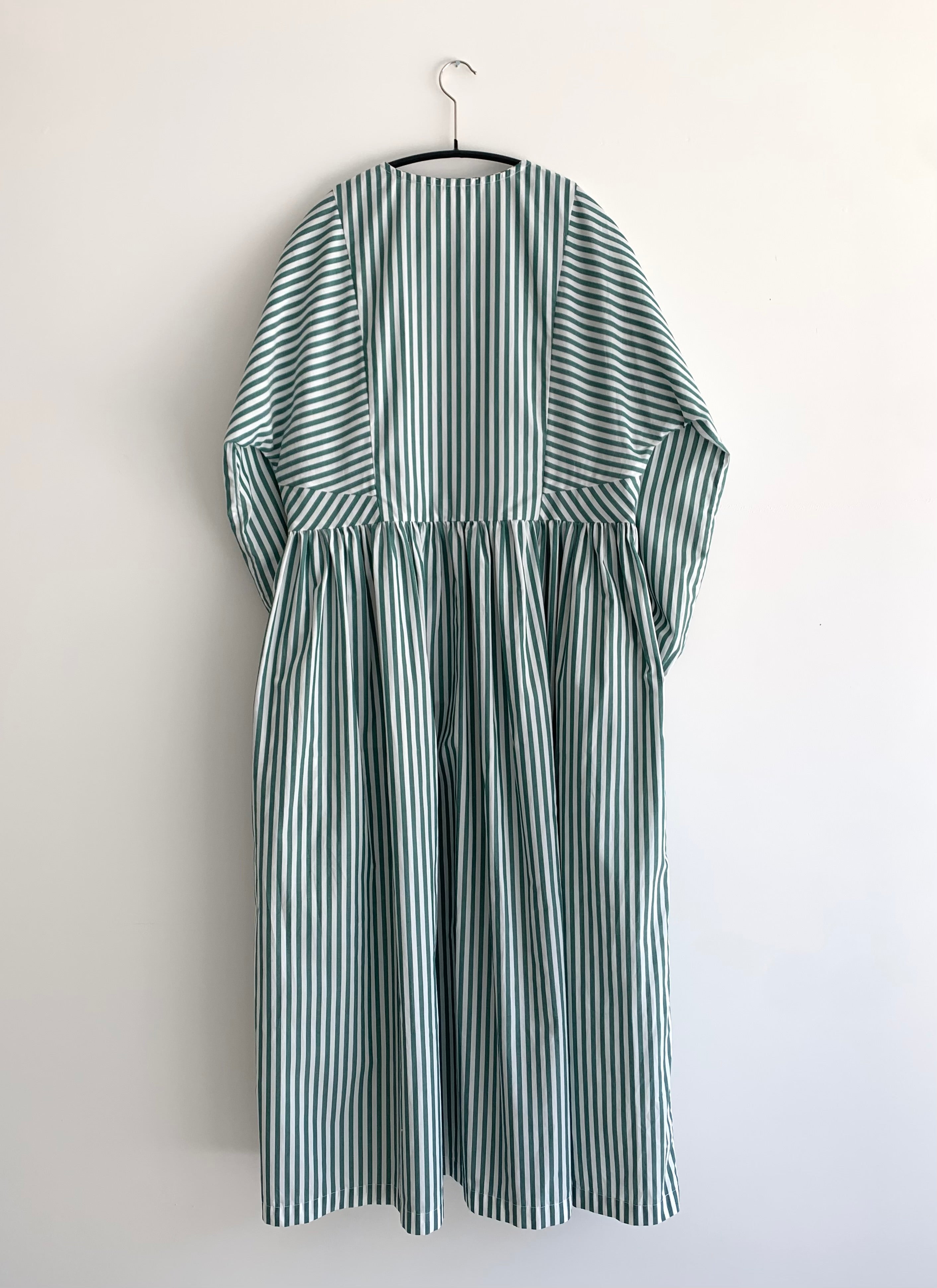 Close-up of the button cuff and dolman sleeve on the green stripe Kamperett Cassatt Dress.