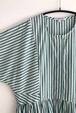 Editorial image of the green stripe Japanese cotton Kamperett Cassatt Dress.