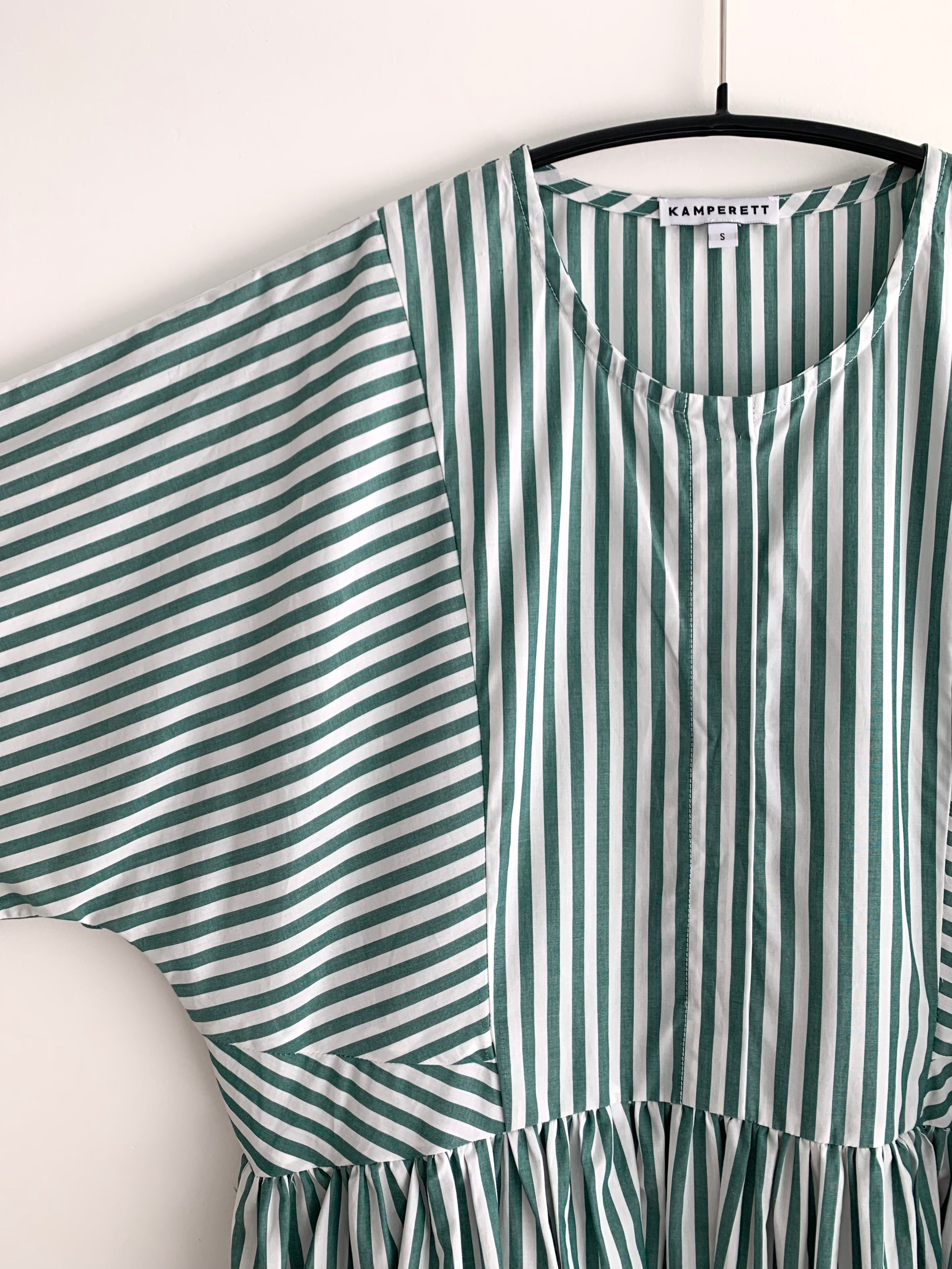 Editorial image of the green stripe Japanese cotton Kamperett Cassatt Dress.