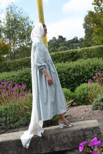 Side view of the green stripe Japanese cotton Kamperett Cassatt Dress with self-belt at the waist.