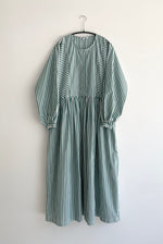 Detail of the green stripe Japanese cotton Kamperett Cassatt Dress showing the gathered waist and self-belt.