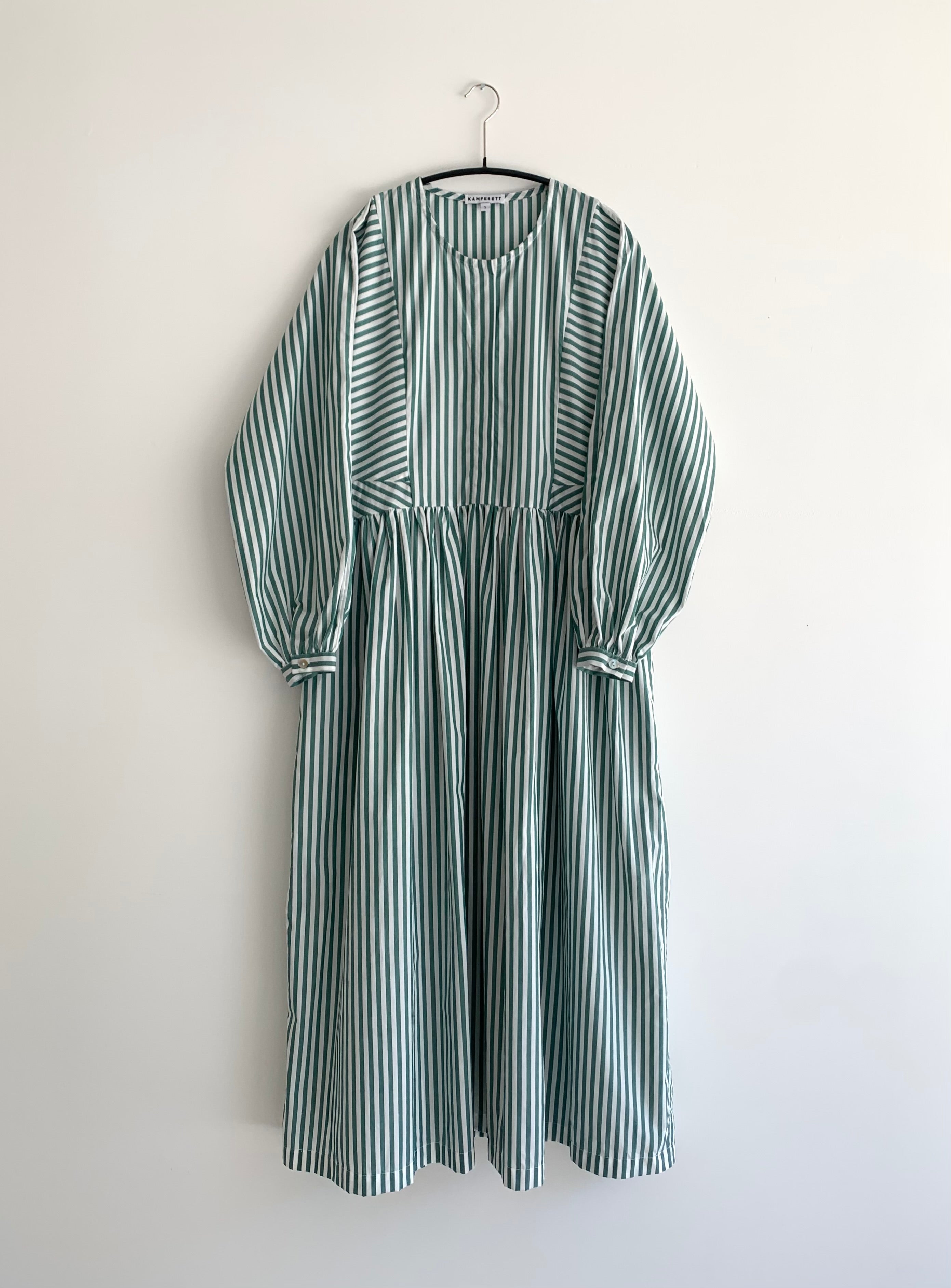 Detail of the green stripe Japanese cotton Kamperett Cassatt Dress showing the gathered waist and self-belt.