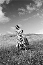 Editorial image of a model in the Cabana stripe Japanese cotton Kamperett Cosette Dress.