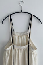 Detail of the adjustable corded back straps on the ivory Japanese linen Kamperett Cosette Dress.