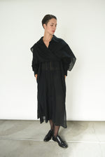 Angled view of the black semi-sheer Japanese cotton voile Kamperett Etude Shirt Dress.