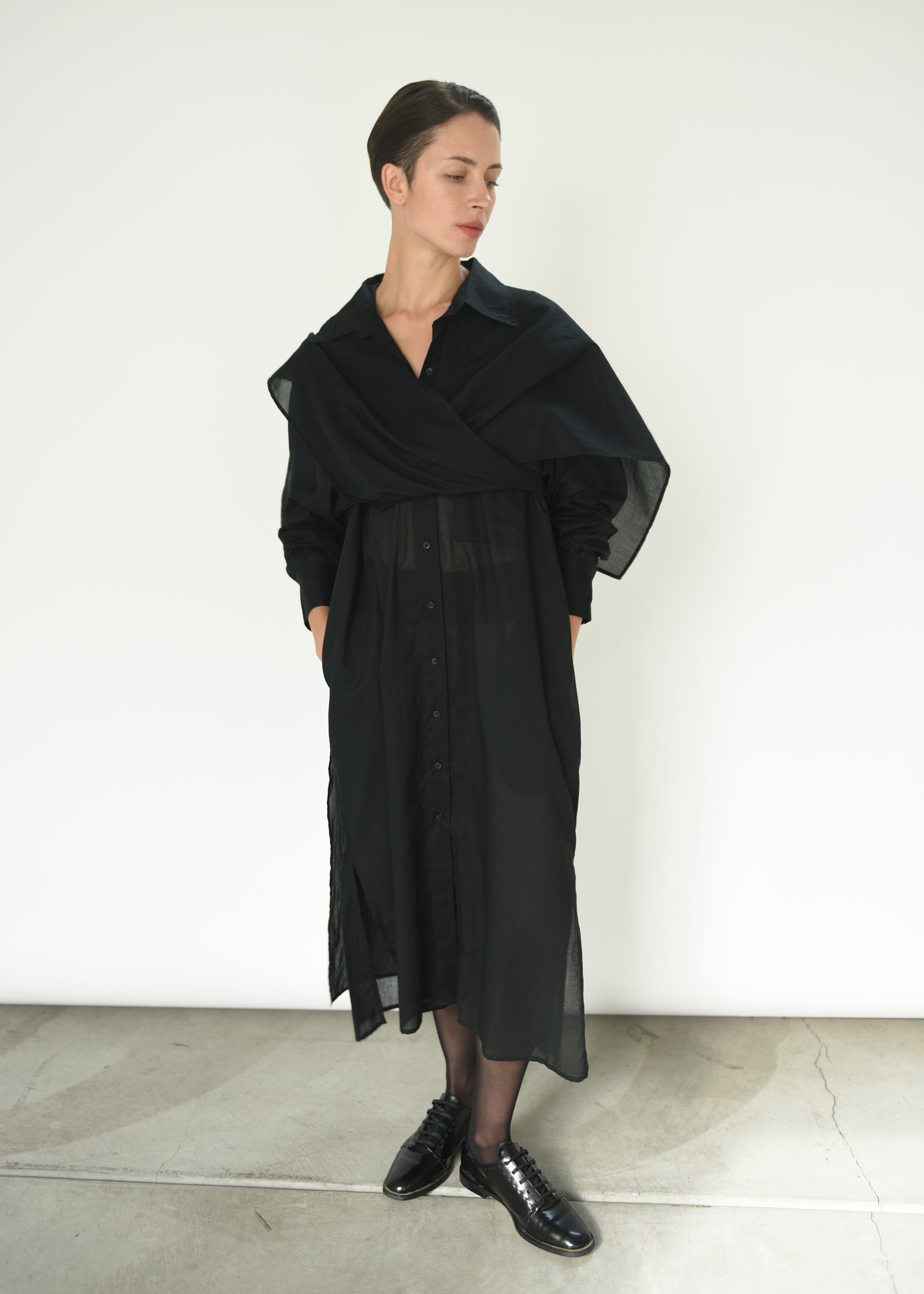 Angled view of the black semi-sheer Japanese cotton voile Kamperett Etude Shirt Dress.