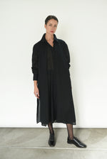 Front view of a model wearing the black semi-sheer Japanese cotton voile Kamperett Etude Shirt Dress.