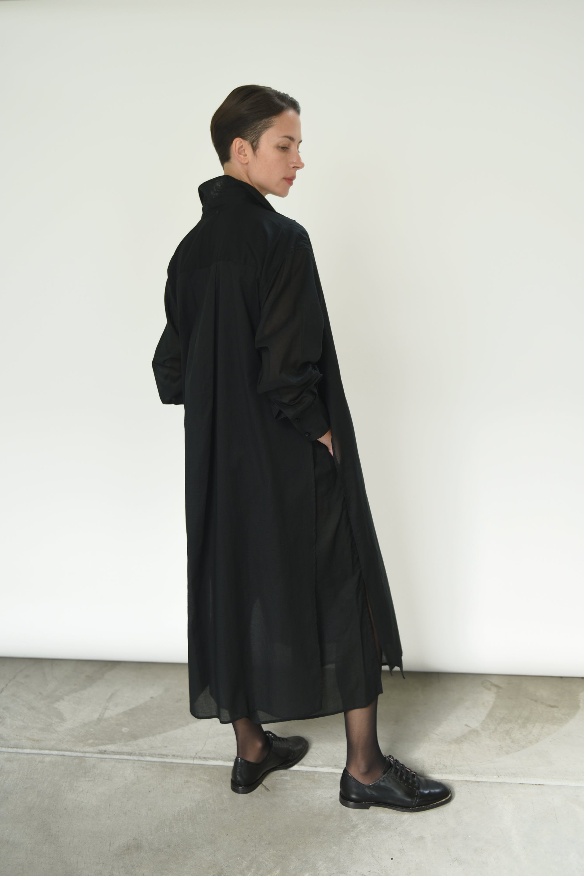Side view of the black semi-sheer Japanese cotton voile Kamperett Etude Shirt Dress.