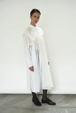 Angled view of the white semi-sheer Japanese cotton voile Kamperett Etude Shirt Dress.