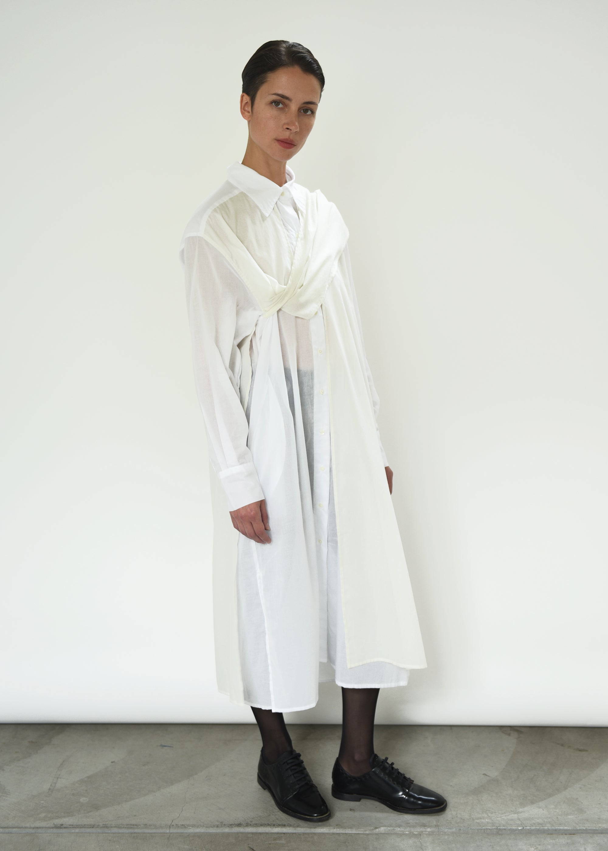 Angled view of the white semi-sheer Japanese cotton voile Kamperett Etude Shirt Dress.