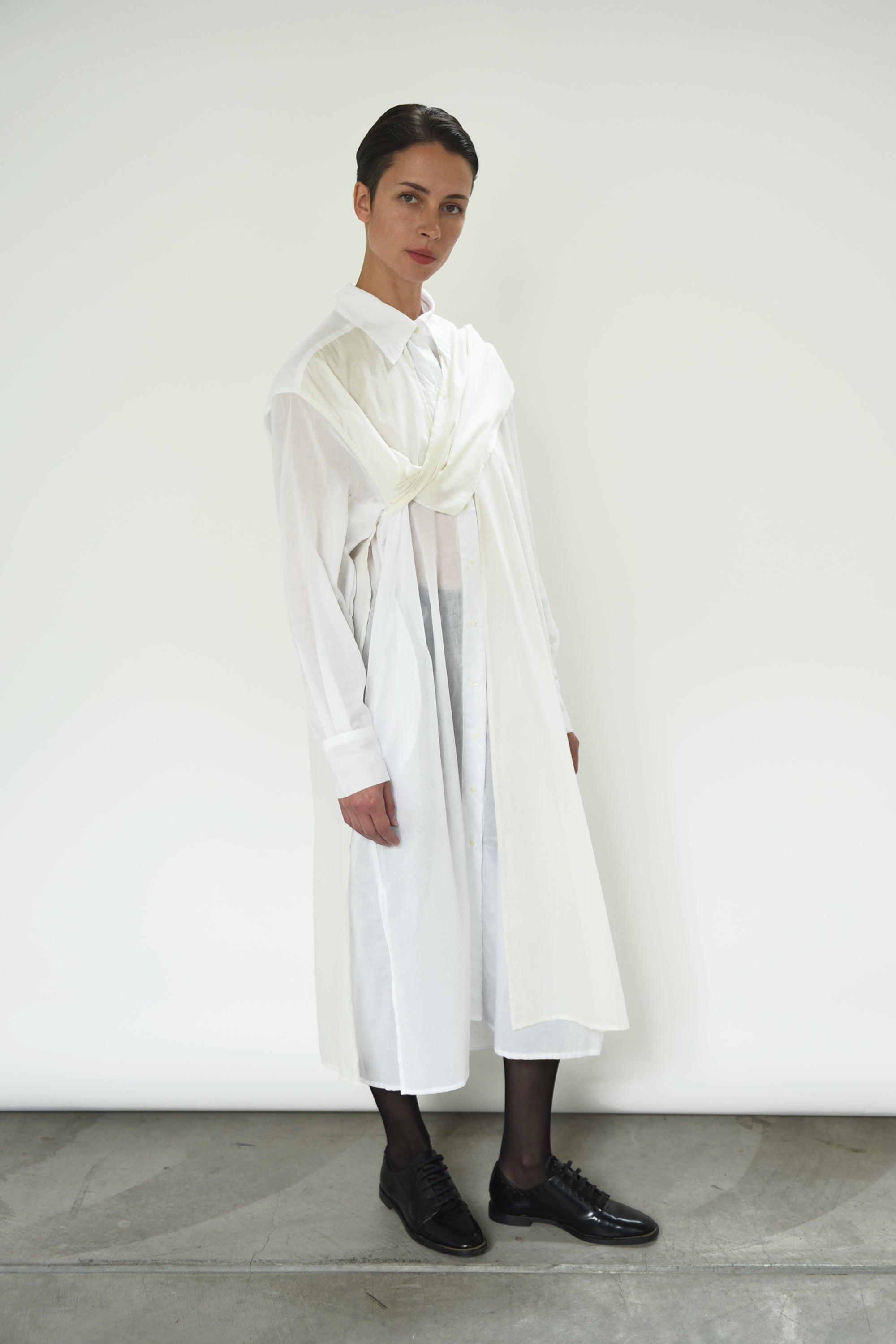 Angled view of the white semi-sheer Japanese cotton voile Kamperett Etude Shirt Dress.