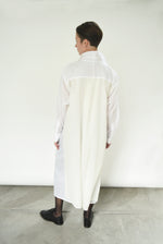 Close-up of the button front and sheer panel detail on the white Kamperett Etude Shirt Dress.
