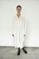 Front view of a model wearing the white semi-sheer Japanese cotton voile Kamperett Etude Shirt Dress.