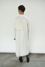 Motion shot of the white Japanese cotton voile Kamperett Etude Shirt Dress, capturing the fluid panel drape.