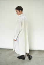 Detail of the fly-away sheer panel on the white Kamperett Etude Shirt Dress.