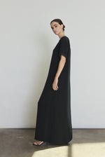 Detail of the black silk crepe Kamperett Galerie Dress showing the fabric and neckline construction.